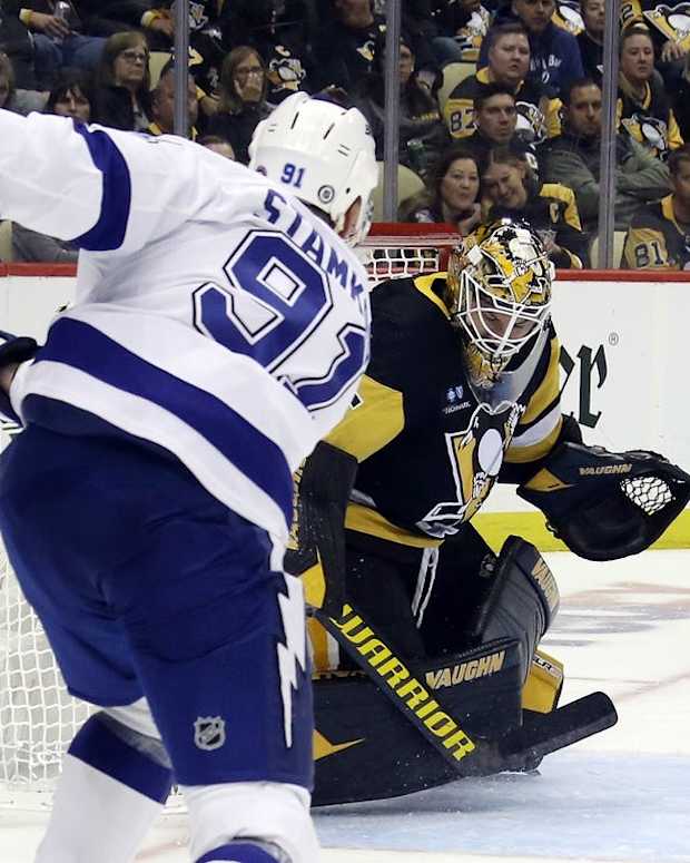 Oct 15, 2022; Pittsburgh, Pennsylvania, USA; Pittsburgh Penguins goaltender Tristan Jarry (35) makes a save against Tampa Bay Lightning center Steven Stamkos (91) during the third period at PPG Paints Arena. The Penguins won 6-2. Mandatory Credit: Charles LeClaire-USA TODAY Sports